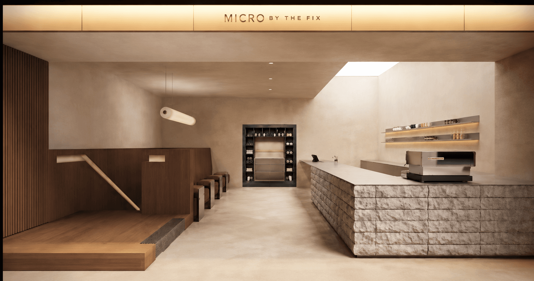 The warm, stone-lined reception space at MICRO in Chelsea