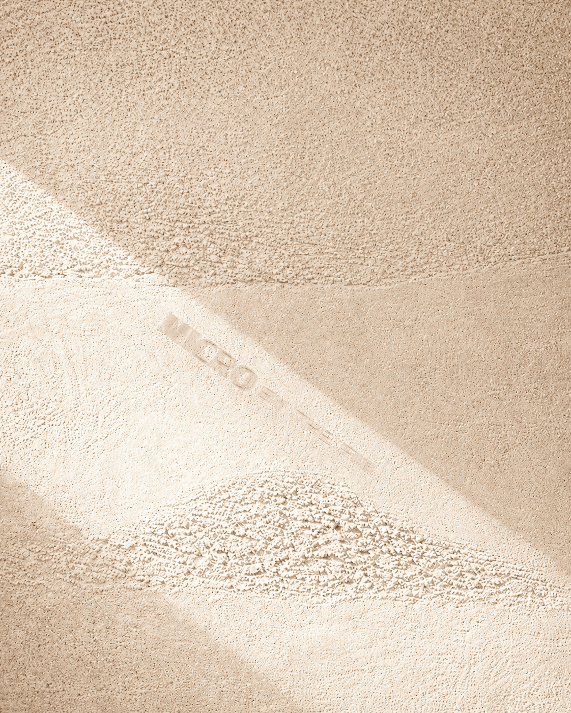 Warm plaster texture in soft raking light